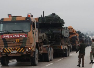 A Turkish military convoy arrives at an army base in the border town of Reyhanli near the Turkish-Syrian border in Hatay Province, Turkey.