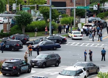 Maryland police officers blocking an intersection in Annapolis after employees were shot Thursday at the Capital Gazette office.