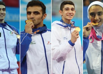 Mehdi Khodabakhshi (L), Masoud Hajizavareh (second L) and Farzan Ashourzadeh (second R) are among the world top 10 ranking of men taekwondokas in their respective weight categories and Kimia Alizadeh is fifteenth in the women’s list of -62 kg group.