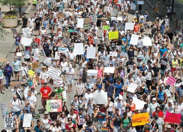 Protesters march through the streets during a demonstration against the US immigration policies separating migrant families in Chicago.