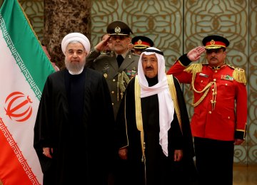 Kuwait’s Emir Sheikh Sabah al-Ahmad al-Sabah (R) receives President Hassan Rouhani who visited Kuwait City on Feb. 15 after a short trip to Oman. 