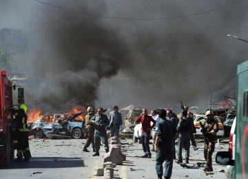 Afghan security forces arrive at the site of a car bomb attack in Kabul on May 31.