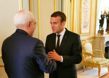 French President Emmanuel Macron (R) meets Iranian Foreign Minister Mohammad Javad Zarif in Paris on June 30.