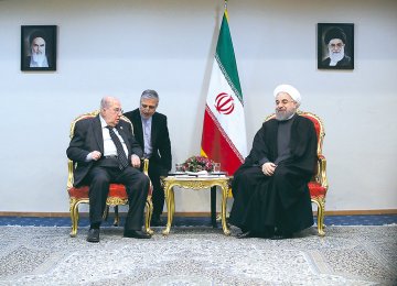 Chairman of the Palestinian National Council Salim Zanoun (L) meets President Hassan Rouhani in Tehran on Feb. 22.