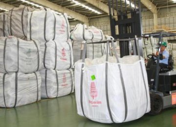 A worker loads bags of rice at a CP Intertrade Company warehouse in Thailand’s Ayutthaya Province. 