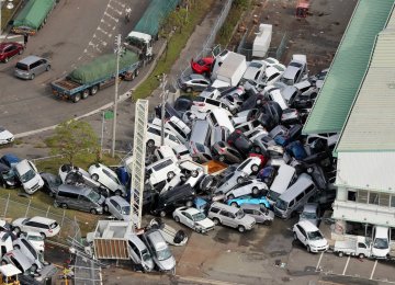 An aerial view shows vehicles piled in a heap due to strong winds in Kobe, Hyogo prefecture on September 5. 