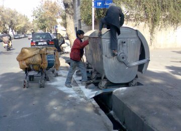  Waste pickers put their lives at risk by diving into unsanitary trash bins.