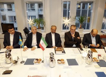 Iranian delegation headed by Mohammad Nahavandian (C)  is working to further banking ties with Sweden. 