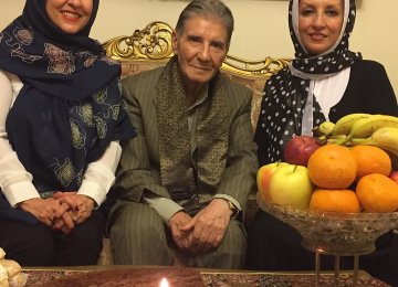 Marjaneh (L) and Manijeh Golchin (R) with their uncle Nader celebrating his 80th birthday.