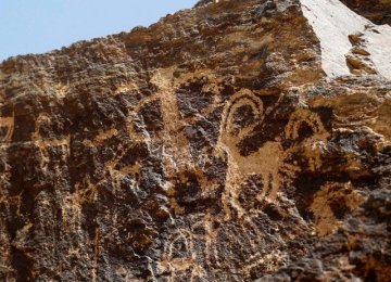 Ancient engravings of animals are seen in the hills outside the town of Khomein in central Iran.