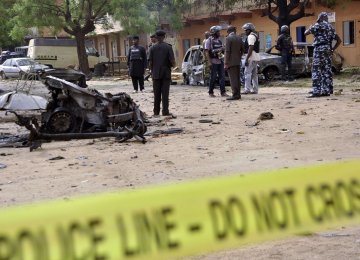 Nigerian security forces arrive at the scene of a previous suicide attack.