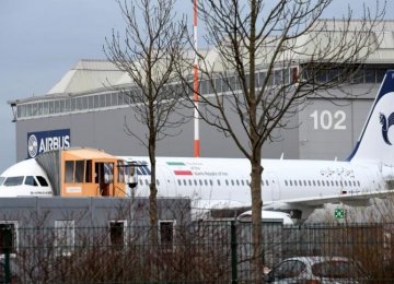 An Airbus A321 with the Iranian flag and description “The airline of the Islamic Republic of Iran” is parked at the Airbus facility in Hamburg Finkenwerder, Germany, on Dec. 19.