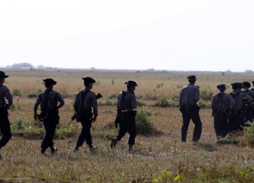 Myanmar police patrol near villages close to Rakhine state.