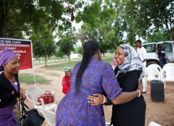 Members of the ‘Bring Back Our Girls’ campaign group are seen as they rejoice over the news of the release of additional 21 girls in Abuja, Nigeria, on Oct. 13.