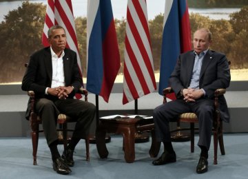 US President Barack Obama (L) meets with Russian President Vladimir Putin during the G8 Summit in Enniskillen, Northern Ireland, June 2013. (File Photo)