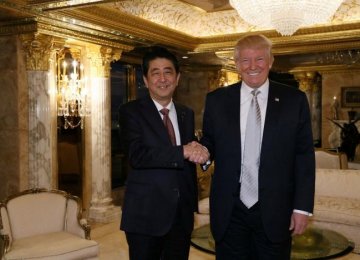 Japan’s Prime Minister Shinzo Abe (L) meets with US president-elect Donald Trump at Trump Tower in Manhattan, New York, USA, on Nov. 17.