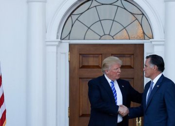 The 2012 Republican presidential nominee, Mitt Romney, met with president-elect Donald Trump on Saturday, trading smiles and tight handshakes as the two set aside a fierce rivalry.