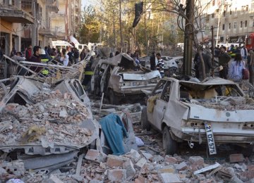 Damaged cars are seen on a street after a blast in Diyarbakir, Turkey, November 4.