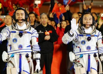 Taikonauts Jing Haipeng (R) and Chen Dong will stay in space for 30 days.
