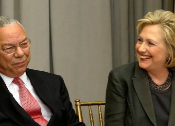 Powell Backs Clinton as Trump Warns of World War III