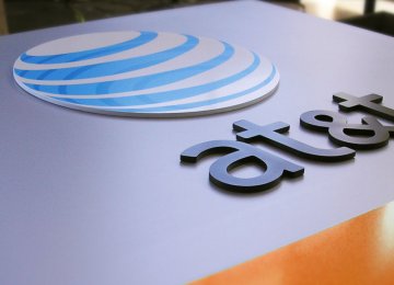 AT&amp;T, Time Warner Shares Dip