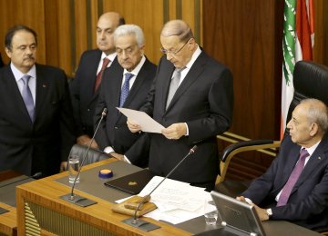 Newly elected Lebanese President Michel Aoun gives a speech next to the Parliament Speaker Nabih Berri (R) as he takes an oath in Beirut on October 31. 