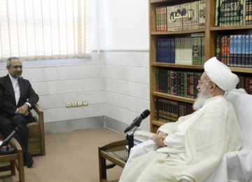 Grand Ayatollah Nasser Makarem-Shirazi (R) receives presidential chief of staff, Mohammad Nahavandian, in Qom on Aug. 27.