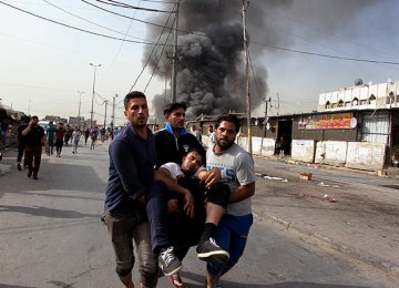 Two Bombings in Baghdad Kill 13