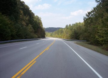 Use of cement instead of bitumen in road construction is justified because the latter can be easily sold in export markets.