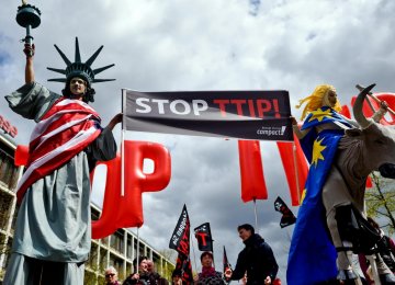 Protesters rallying against the TTIP and CETA free trade agreements march in April 2016.