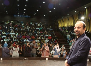 Asghar Farhadi standing in front of the audiences waiting to see his film at Kourosh Cineplex