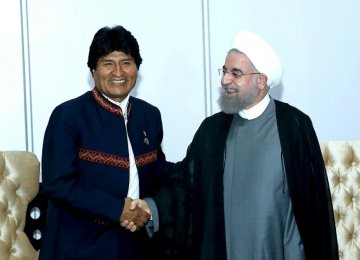 Bolivian President Evo Morales (L) shakes hands with his Iranian counterpart, Hassan Rouhani, in Venezuela on Sept. 17. 