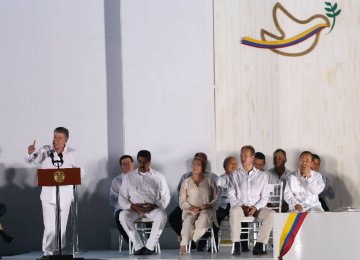 Colombia’s President Juan Manuel Santos (L) delivers a speech after he signed a peace agreement between Colombia’s government and the FARC in Cartagena, Colombia, on Sept. 26.
