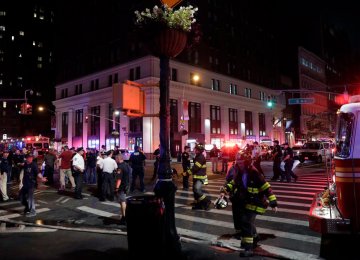 New York police and fire officials respond to an explosion in the Chelsea neighborhood of New York City on Sept. 17.