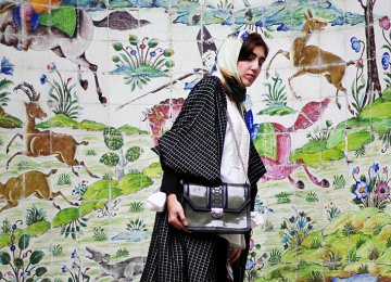 A model poses at Tehran’s Niavaran Palace dressed in Iranian designer garments and accessories. (Photo: Donya Joshani/The Tehran Times fashion blog)