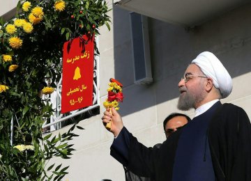  Rouhani was at the school to ceremonially ring the school bell, marking the beginning  of the new academic year.