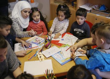 Germany is investing heavily in the education of new immigrants and has recruited 8,500 teachers to teach German  to 196,000 child refugees.