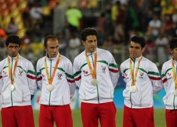Members of the Iranian men’s national football 7-a-side team with their silver medals.