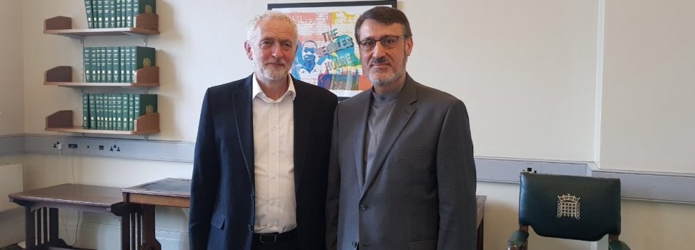 Iran’s Ambassador to London Hamid Baeidinejad (R) meets with the leader of the UK Labour Party Jeremy Corbyn in London on Monday.