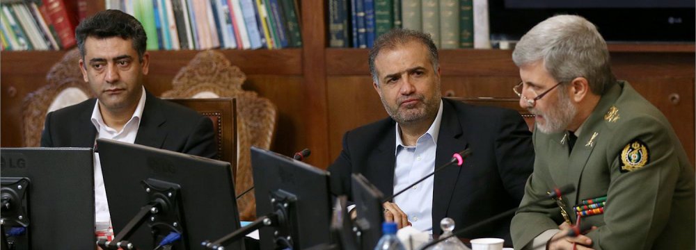 Defense Minister General Amir Hatami (R) addresses a parliamentary meeting in Tehran on April 15. 