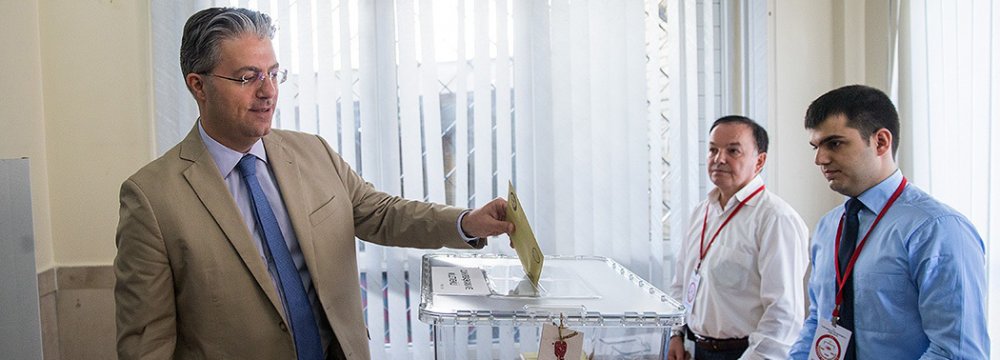 Turkish Ambassador Reza Hakan Tekin  cast his vote in the presidential and parliamentary elections in Tehran on Sunday.