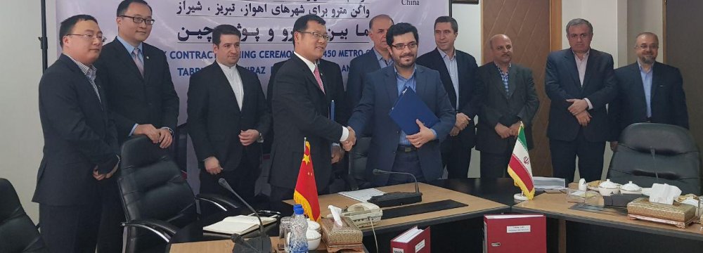 The Industrial Development and Renovation Organization of Iran and Chinese firm CRRC Nanjing Puzhen signed a contracts for design, procurement, supply, manufacture and delivery of 450 subway wagons for the Iranian cities of Ahvaz, Shiraz and Tabriz on Wednesday.