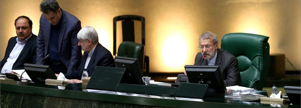 Parliament Speaker Ali Larijani (R) addresses lawmakers at the latest open session on May 15.