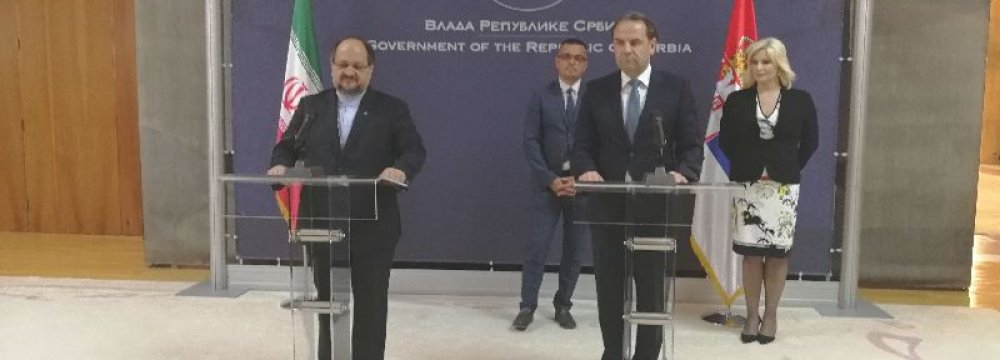 Iran’s Minister of Industries, Mining and Trade Mohammad Shariatmadari (L) and Serbian Minister of Trade, Tourism and Telecommunications Rasim Ljajic (2nd R) address a press conference in Belgrade on June 21.