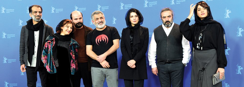 From left to right: Ali Bagheri, Leili Rashidi, Ali Mosaffa, Mani Haghighi, Leila Hatami, Hassan Majouni  and Parinaz Izadyar pose during the photo call for ‘Pig’ in Berlin, February 21. (Photo: AFP)