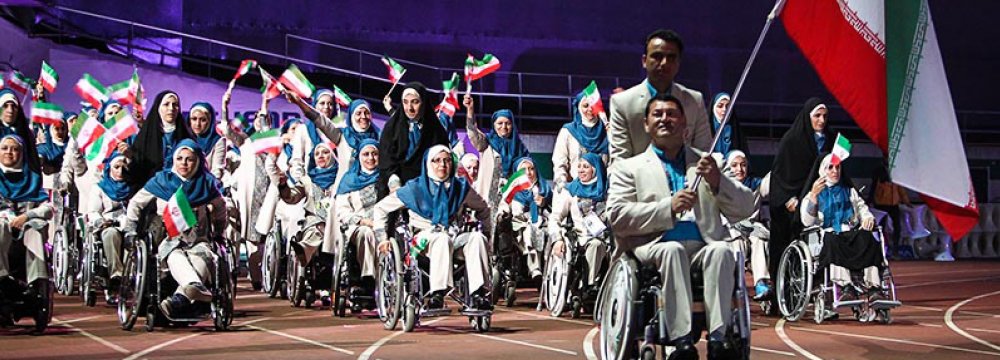 Iran’s delegation march at the opening ceremony of Incheon Para Asian Games in South Korea, 2014.
