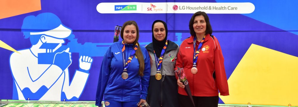 Sareh Javanmardi (C) won gold at the Cheongju 2018 World Shooting  Para Sport Championships.