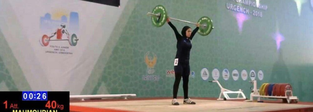 Parmida Mahmoudian lifts a weight at the Uzbekistan games.