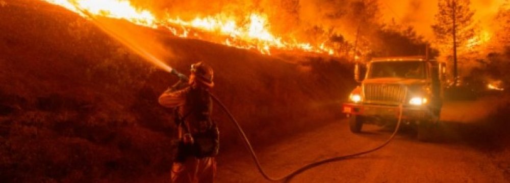 Thousands Flee California Fires