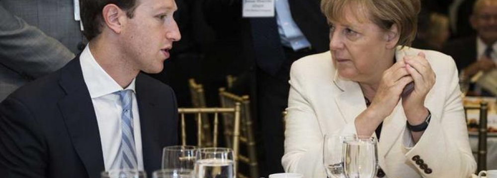 Zuckerberg Promises Merkel  to Fight Hate Speech